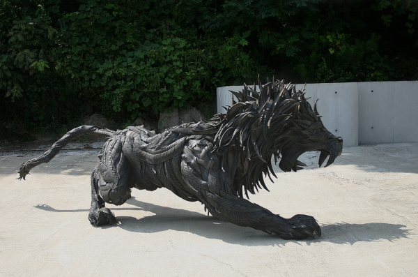 Roaring lion made of used tires